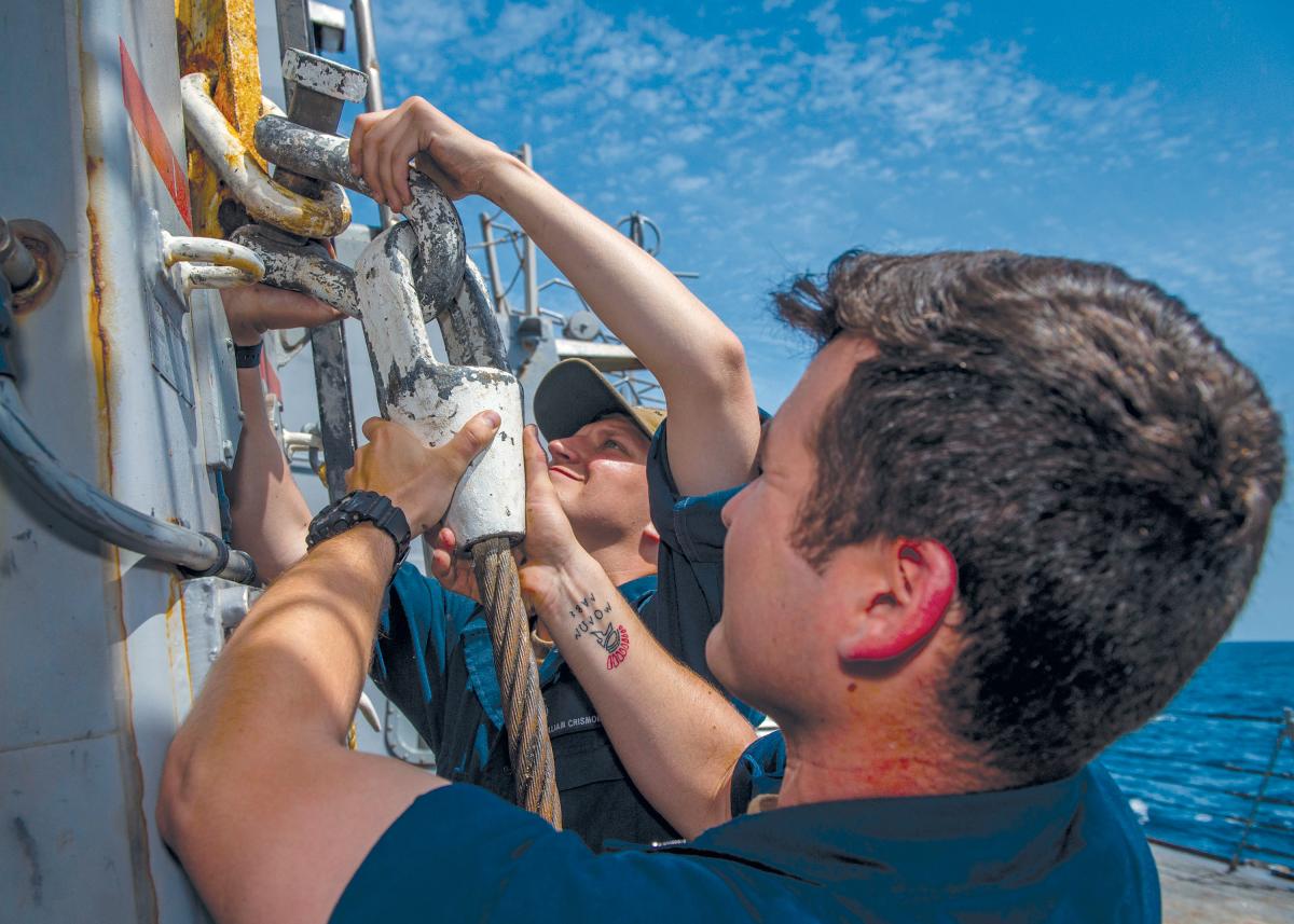 Sailors perform maintenance on a king’s post aboard the Arleigh Burke-class guided-missile destroyer USS Bainbridge (DDG-96)
