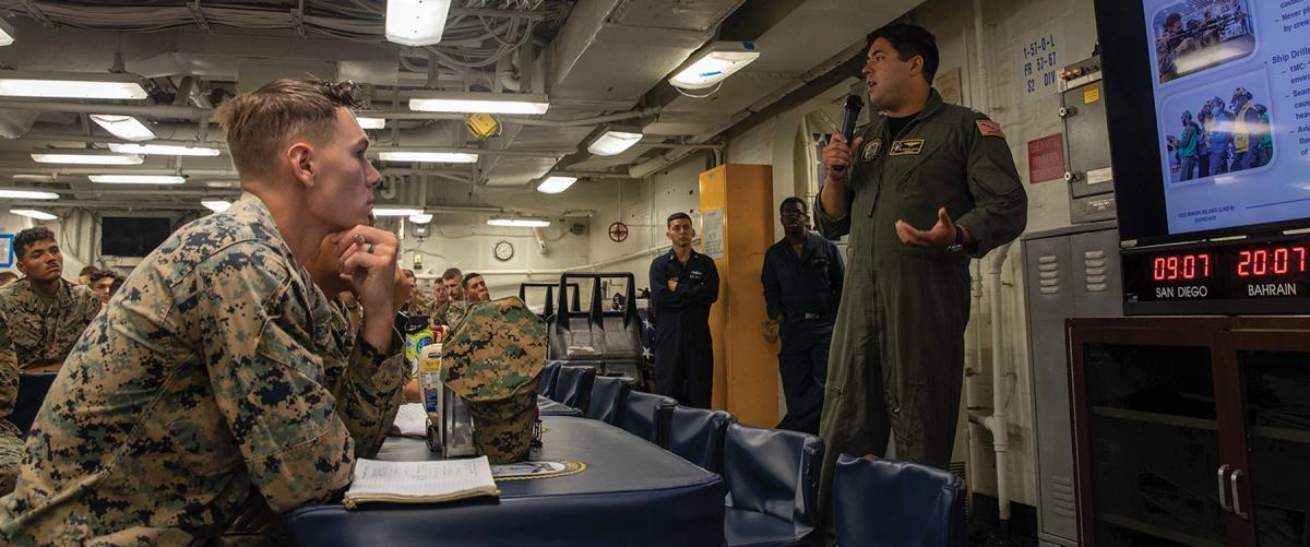 The safety officer on board the USS Makin Island (LHD-8) discusses safety with Marines assigned to the 13th Marine Expeditionary Unit. The Navy needs to implement changes to safeguard its most important assets—sailors and Marines.