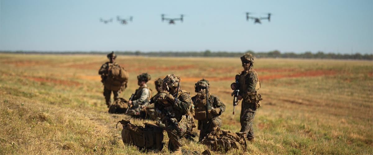 Marines from the 3d Battalion, 7th Marine Regiment, Marine Rotational Force–Darwin 22, observe an MV-22 Osprey land during exercise Southern Jackaroo 22 at Shoalwater Bay Training Area. 