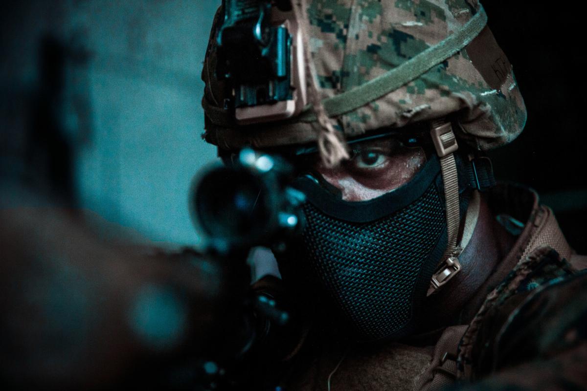 A Marine Corps rifleman during a night raid as part of a larger exercise.