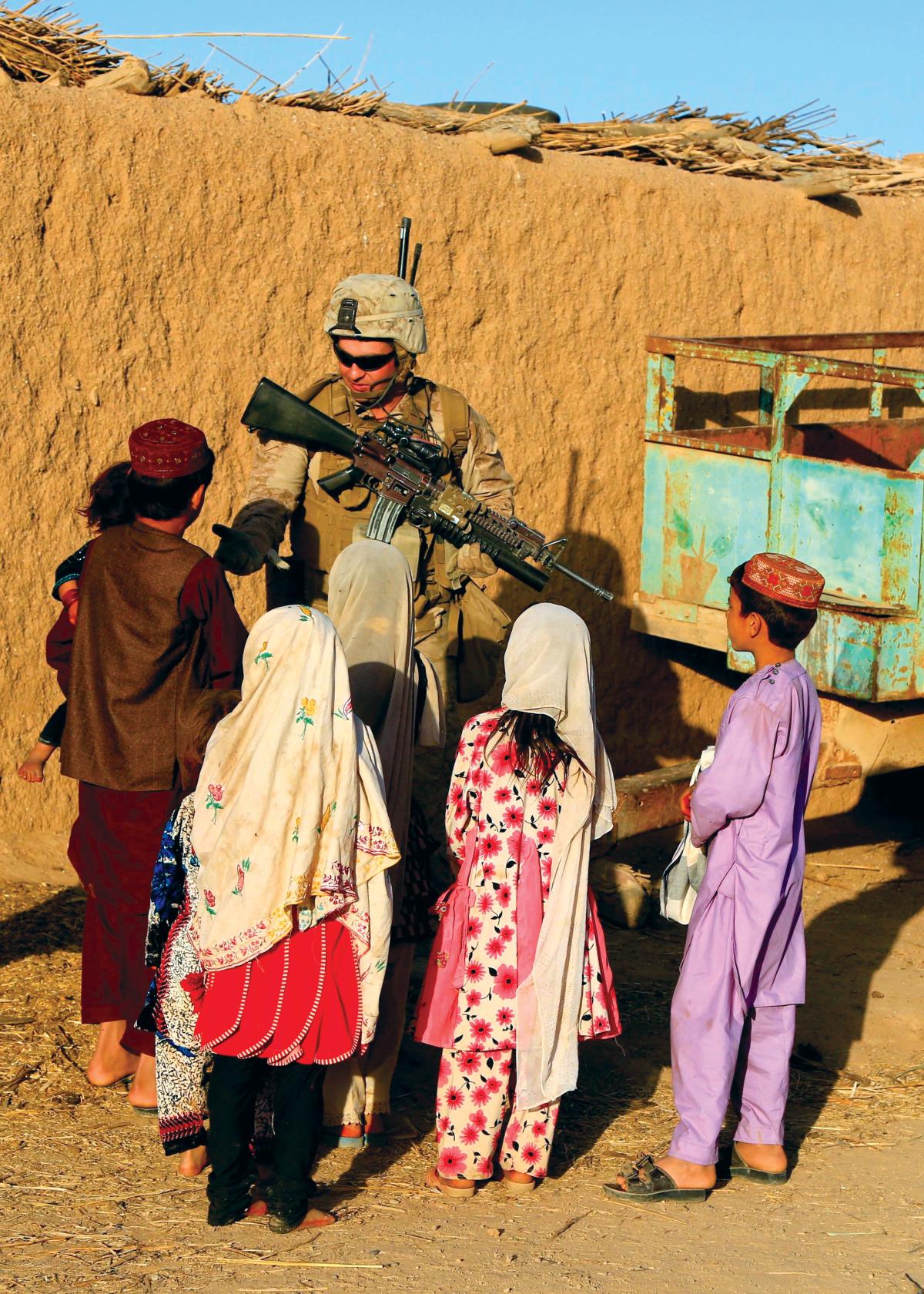  Marine speaking with local villagers