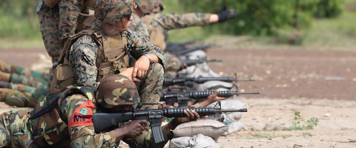 U.S. Marines train with a member of the Ghana armed forces in marksmanship near Daboya, Ghana, during African Lion 23. Headquartering AfriCom in Africa would enhance its ability to support and cooperate with African nations.