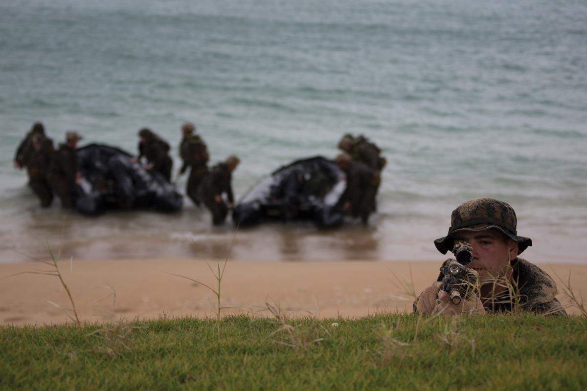 Marines from the 31st Marine Expeditionary Unit on board the USS Ashland (LSD-48) secure a beach on Okinawa during a 2019 exercise.