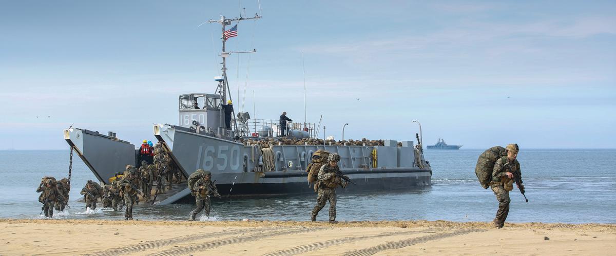 Landing Craft Utility 1650 disembarks Marines during an amphibious exercise. The success of EABO will depend on the Marine Corps' ability to land Marines and their equipment quickly and replenish them as needed.