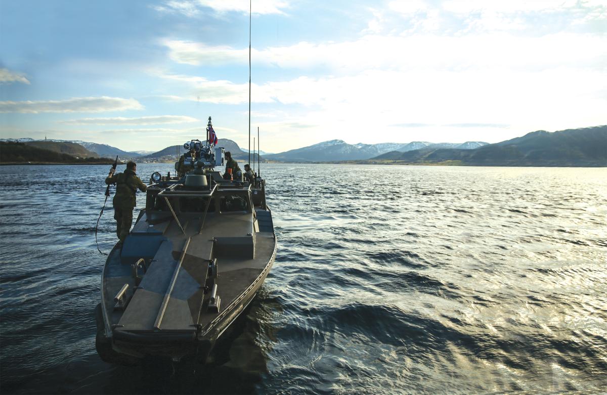 U.S. Marines and Norwegian Coastal Ranger Commandos on a CB90 fast-assault craft during Exercise Platinum Ren at Fort Trondenes, Harstad, Norway, in May 2018.