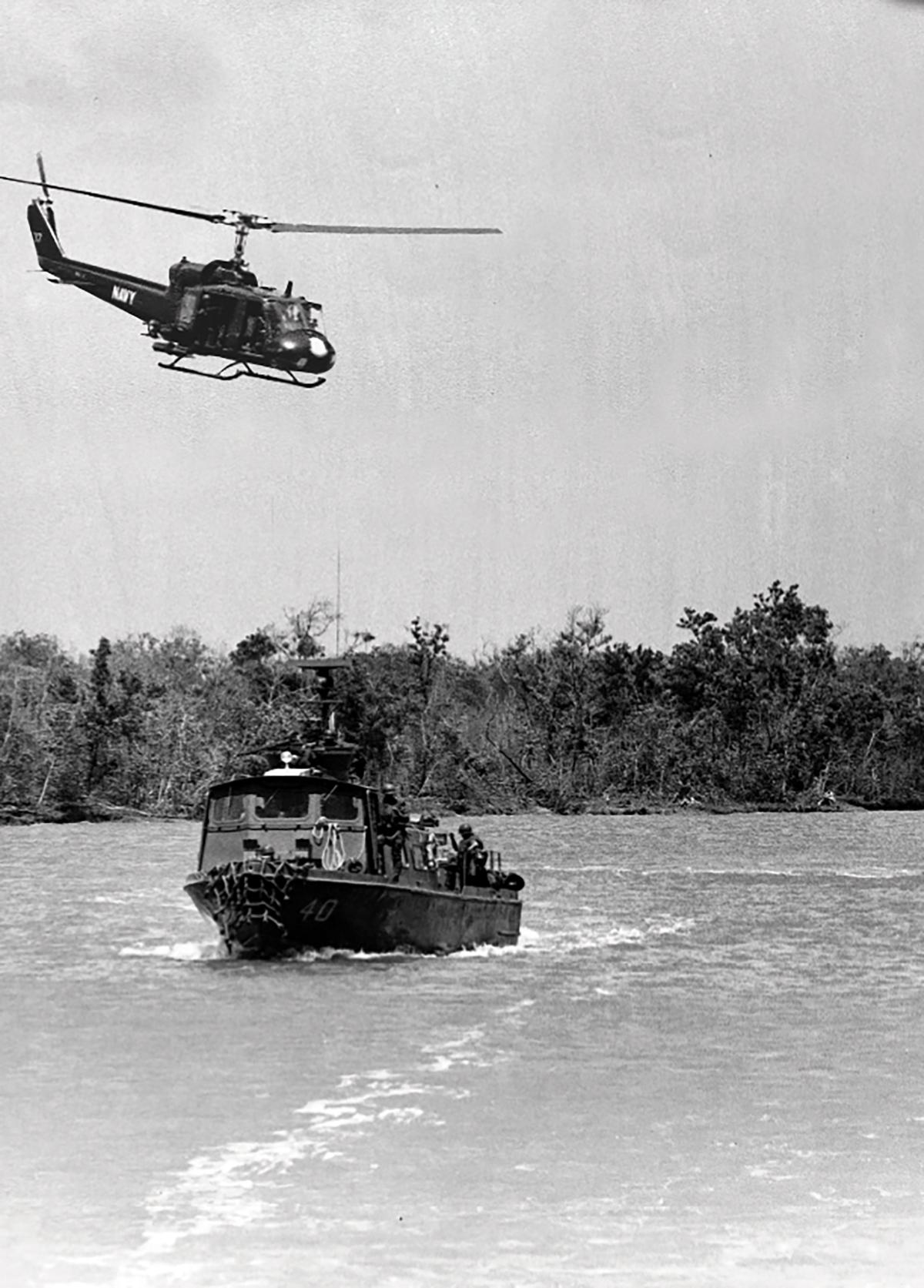 A UH-1B of HA(L)-3 flying over PCF-40 in Vietnam