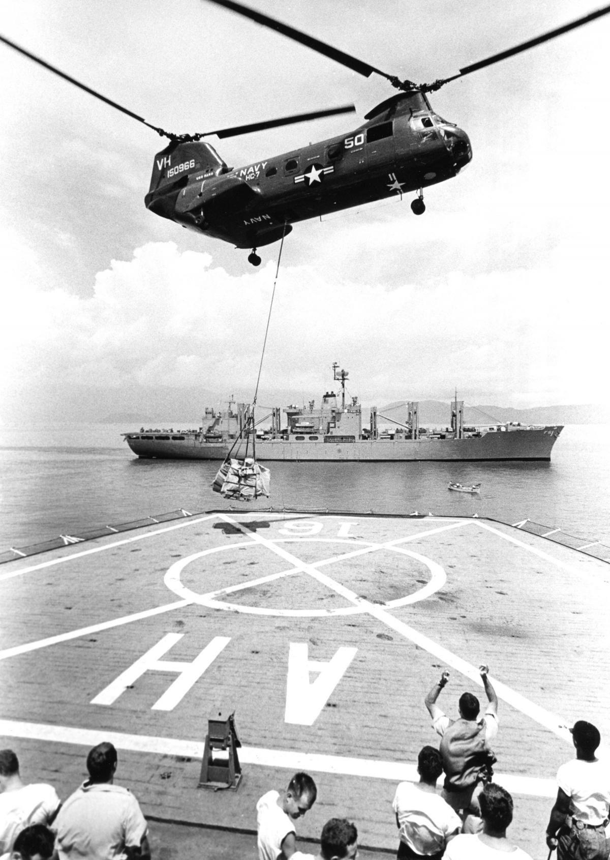 USS Repose (AH-16) receives vertical replenishment from a Navy CH-46A Sea Knight helicopter