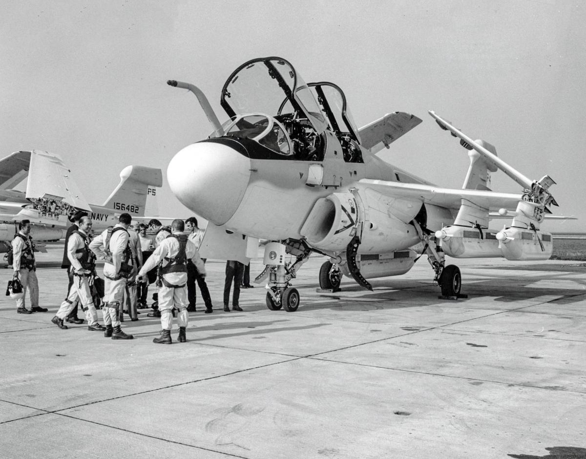 Ground-to-ground left front view of an EA-6B Prowler with crew standing outside