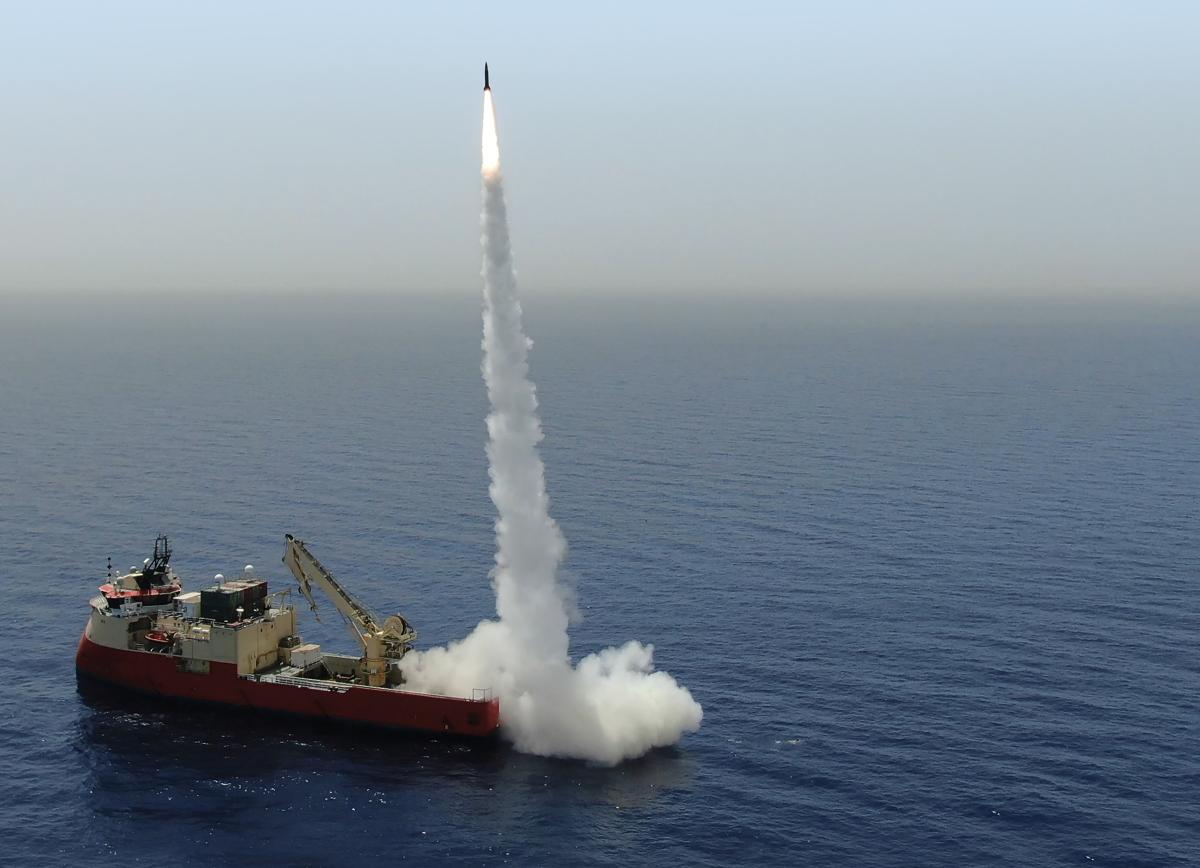 An IAI LORA missile is test-fired from a cargo ship.