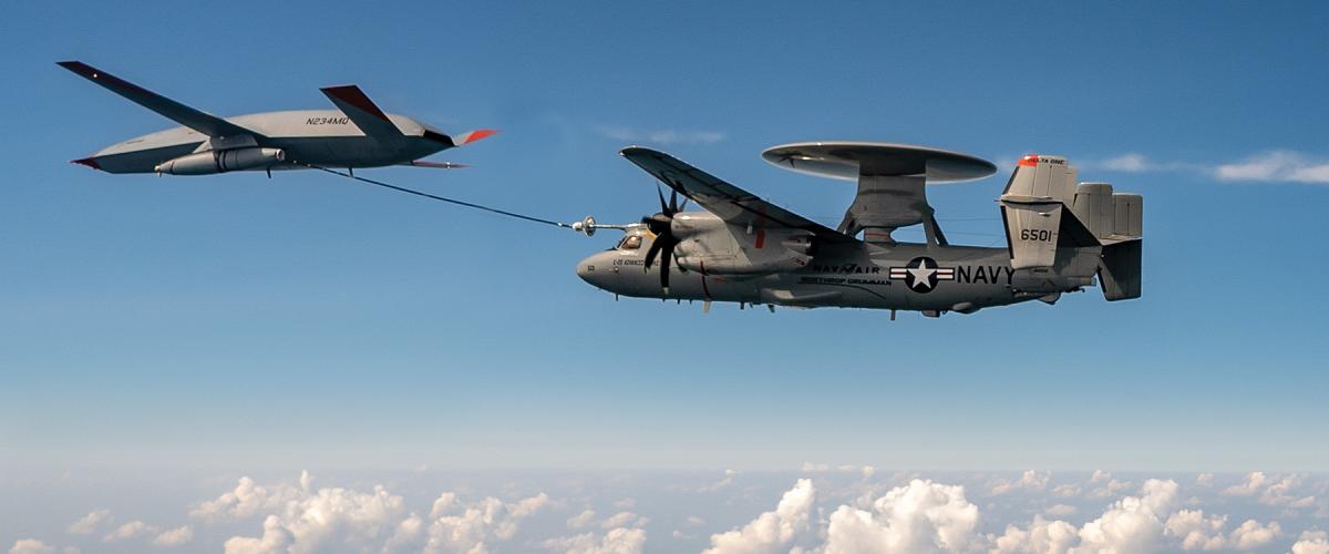 A MQ-25 Stingray refuels a E-2D Advanced Hawkeye.