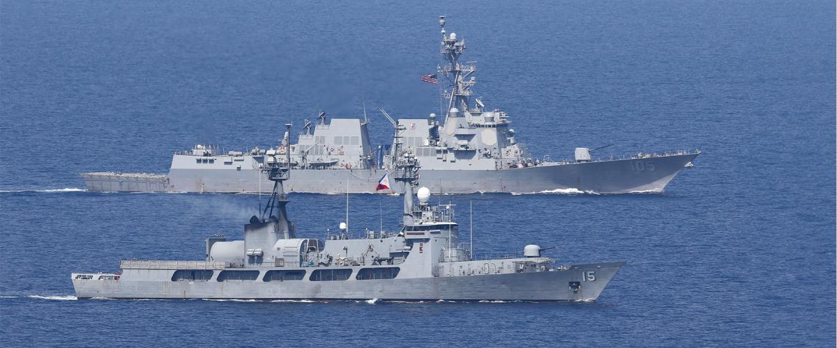 The destroyer USS Dewey (DDG-105) steams in formation with the Philippine Navy offshore patrol vessel Gregorio del Pilar during a bilateral sail in the South China Sea. Joint exercises are one way of revitalizing the U.S.-Philippine alliance.