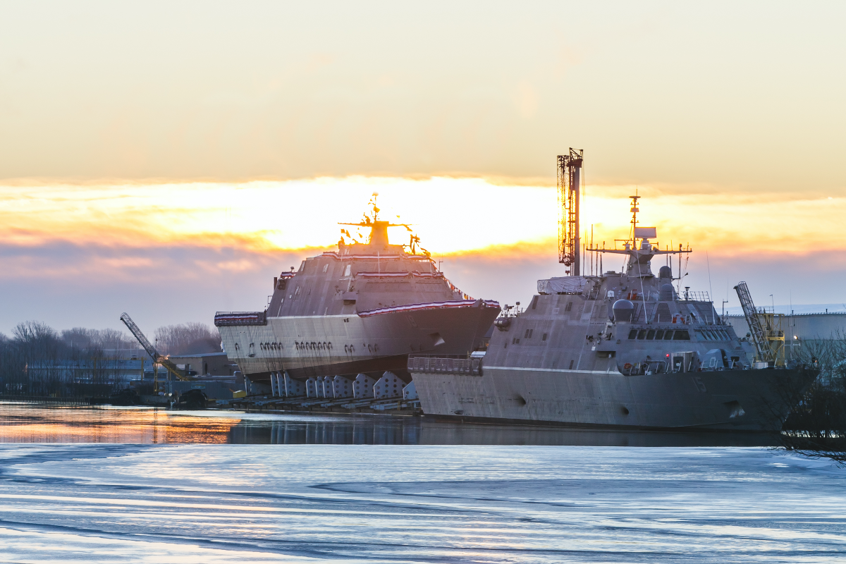The Navy prepares to christen the future littoral combat ship USS St. Louis (LCS-19), left, in Marinette, Wisconsin, as the USS Billings (LCS-15) is under construction and preparing for commissioning.