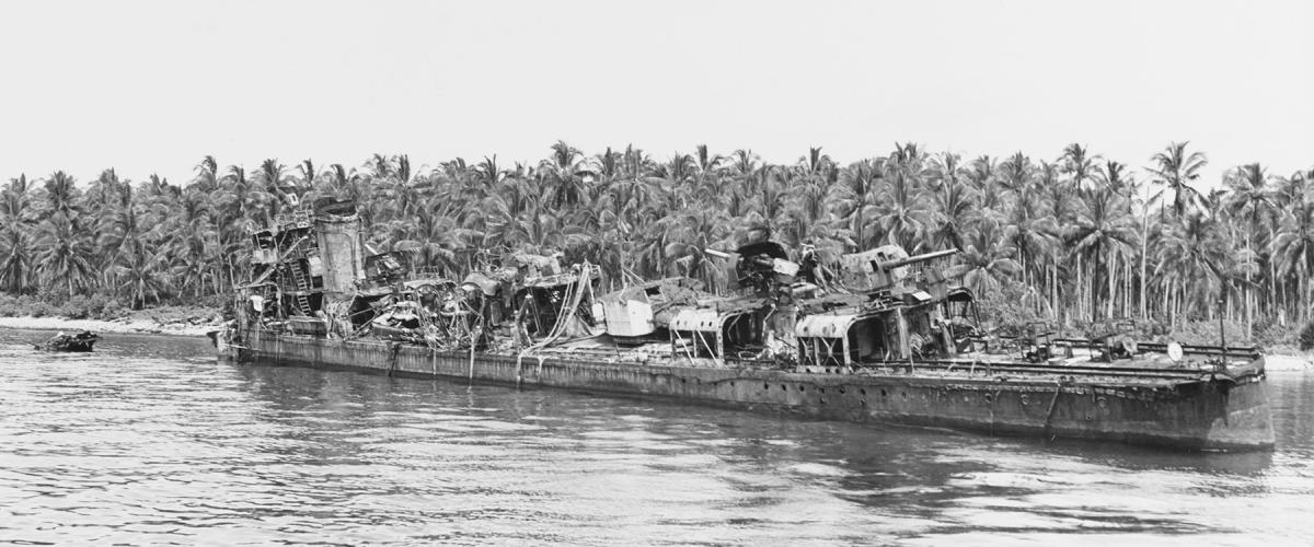 The Imperial Japanese destroyer Nagatsuki aground off Bambari Harbor after being battered by U.S. airstrikes.