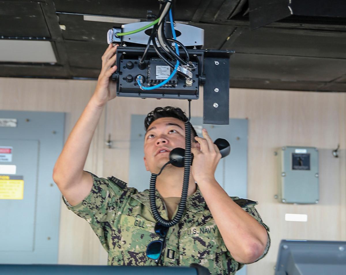 Strategic sealift officer runs radio tests in the USNS Benavidez (T-AKR-306).