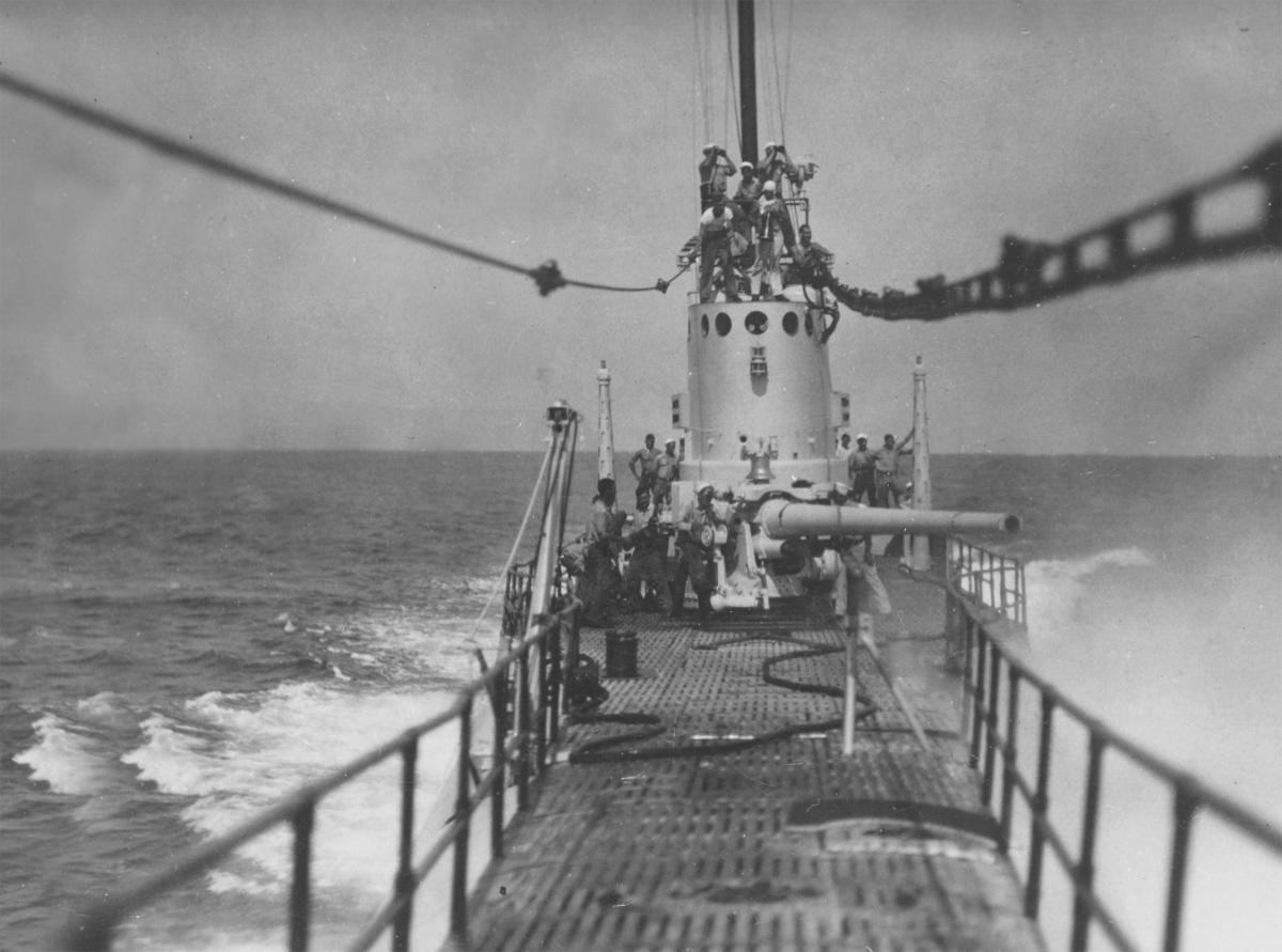 A U.S. Navy submarine firing its gun in the 1930s.