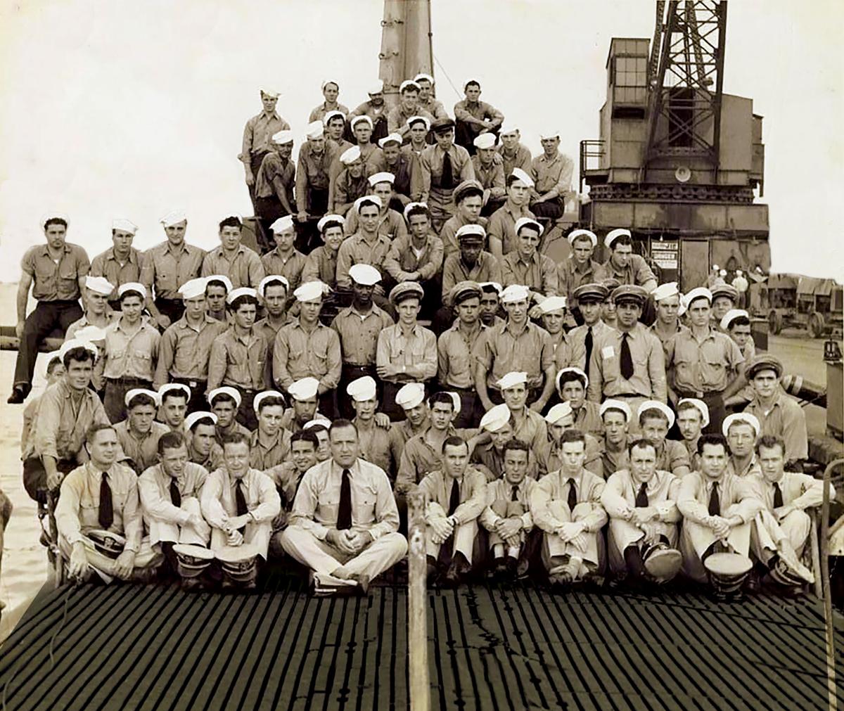 Crew of the USS Seahorse posing on their submarine