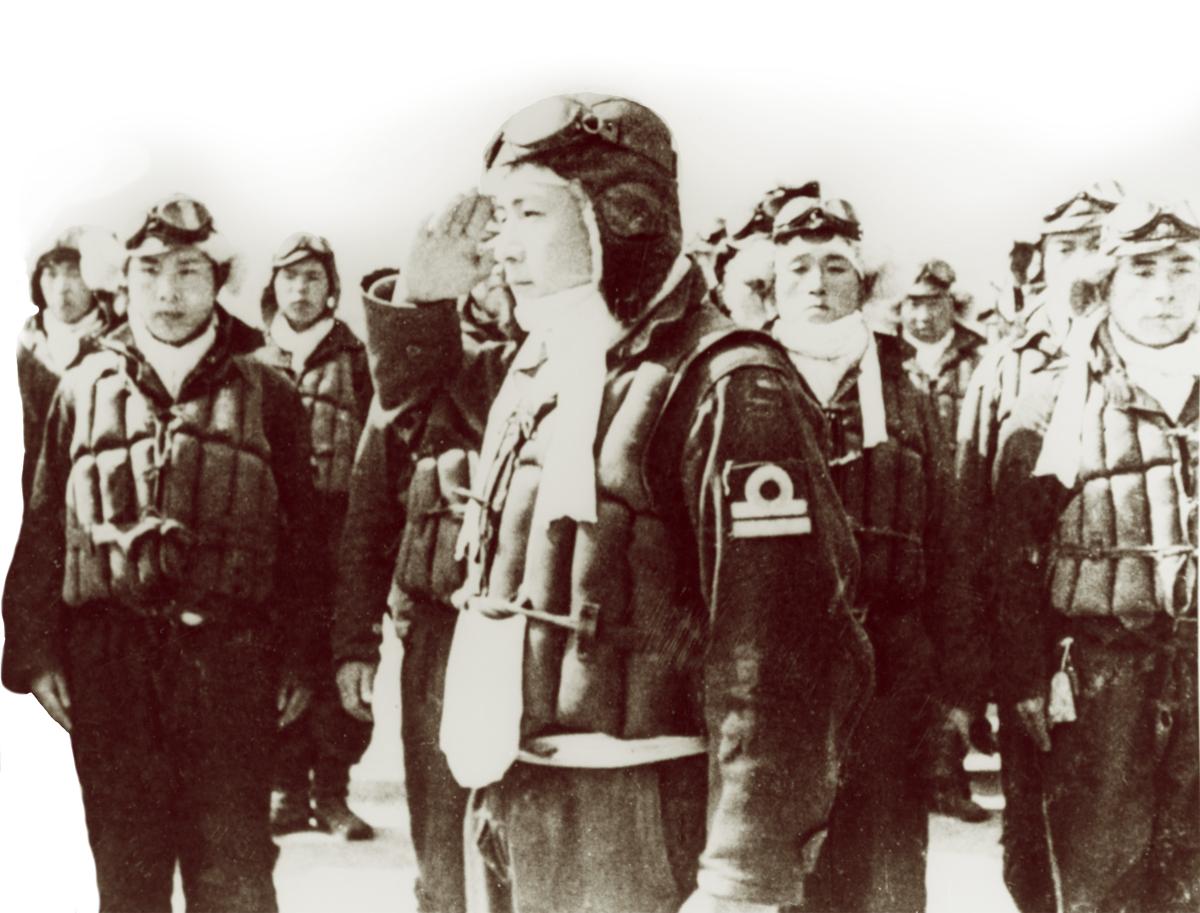 Final mission: A kamikaze pilot (a naval lieutenant, as indicated by the two bars on his sleeve) salutes as he receives his sortie orders. In their deadly attacks on U.S. ships, “kamikazes exploited everything the Japanese had learned about Navy radars and their limitations.”
