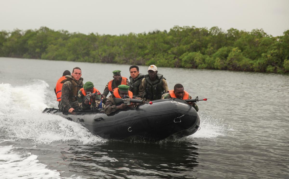 Part of a security cooperation team, U.S. Marines conduct a small boat formation exercise with their counterparts in Senegal. A Navy command modeled on the Marine Corps Security Cooperation Group could formally coordinate security cooperation activities to improve U.S. interoperability with allied navies.