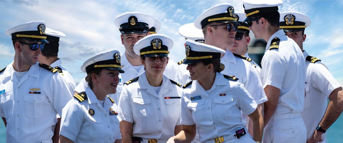Officers assigned to the fast-attack submarine USS North Carolina (SSN-777) gather topside on the boat’s return to Joint Base Pearl Harbor–Hickam following an extended Indo-Pacific deployment.