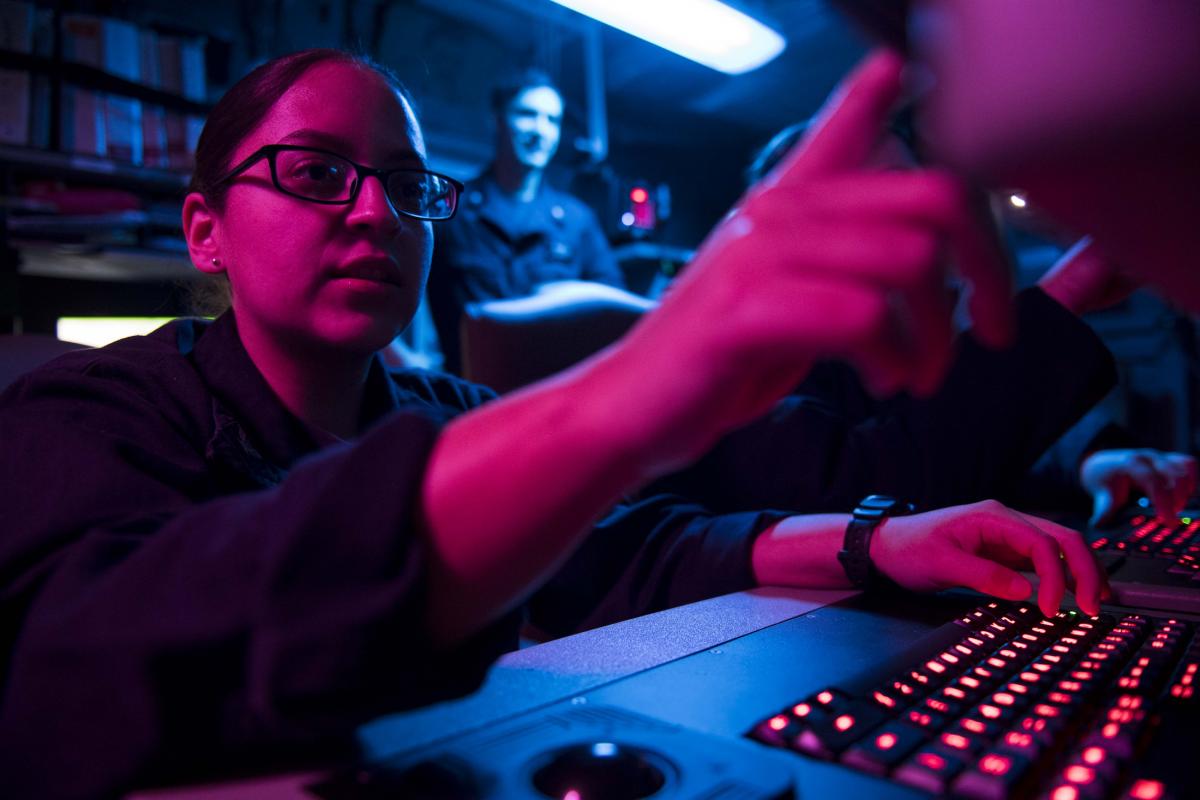 Cryptologic Technician (Collection) 3rd Class Ambar Morales-Diaz analyzes data aboard the aircraft carrier USS Theodore Roosevelt (CVN-71)