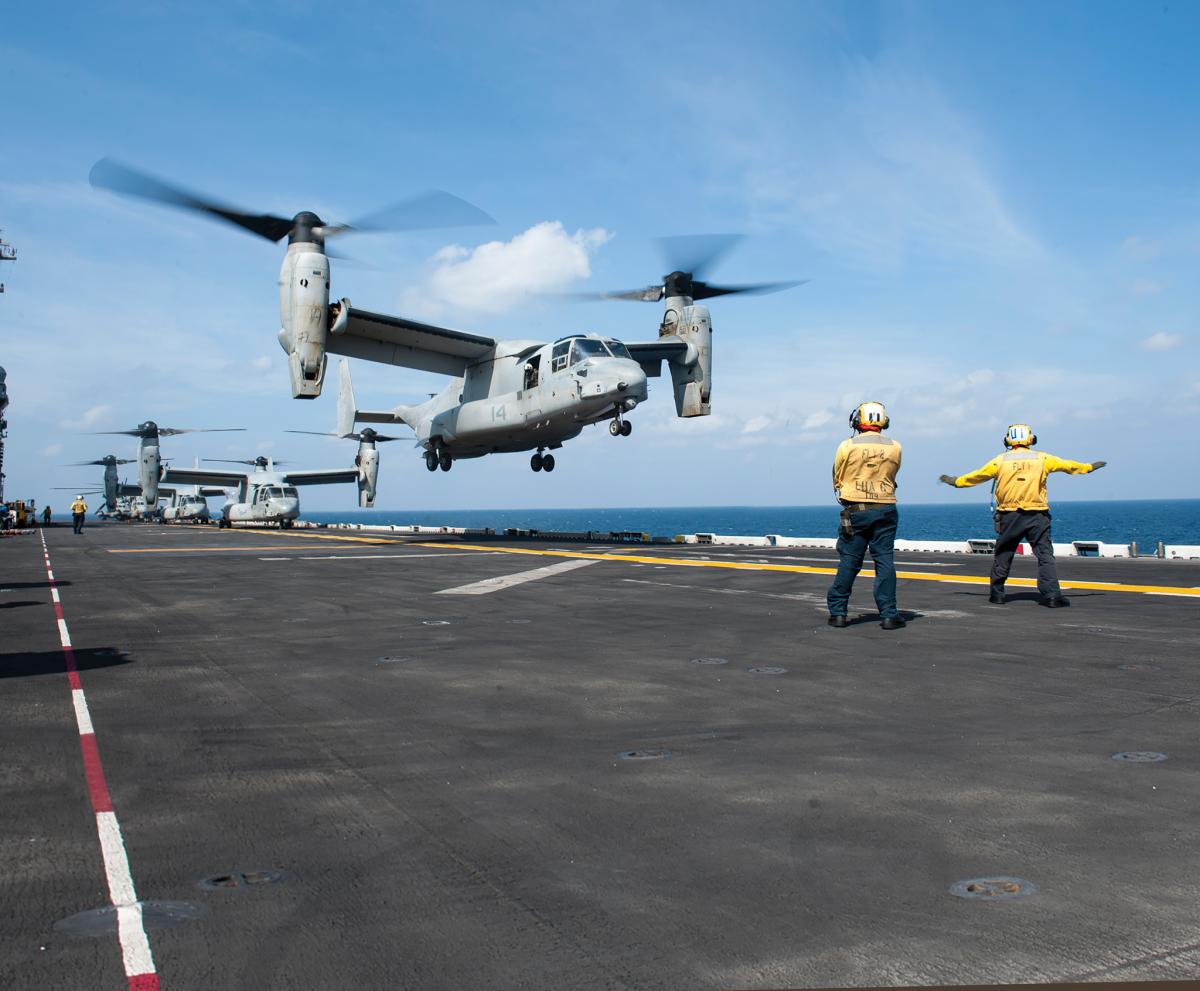 An MV-22 Osprey assigned to Marine Medium Tiltrotor Squadron (VMM) 161 (Reinforced) aboard the amphibious assault ship USS America (LHA 6) lifts off from the flight deck during routine flight operations.
