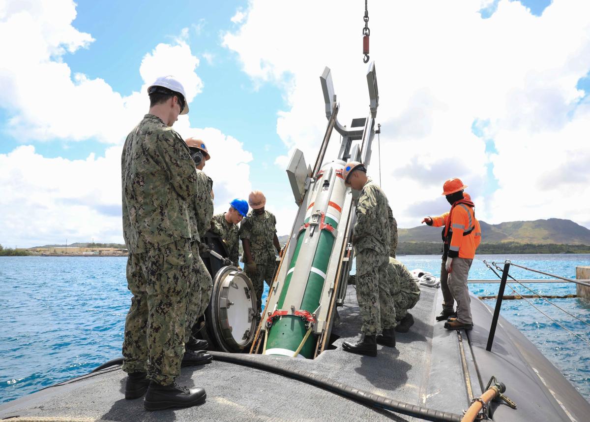 Sailors assigned to the Los Angeles–class fast-attack submarine USS Annapolis (SSN-760) load a Mk 67 submarine launched mobile mine in Agana, Guam