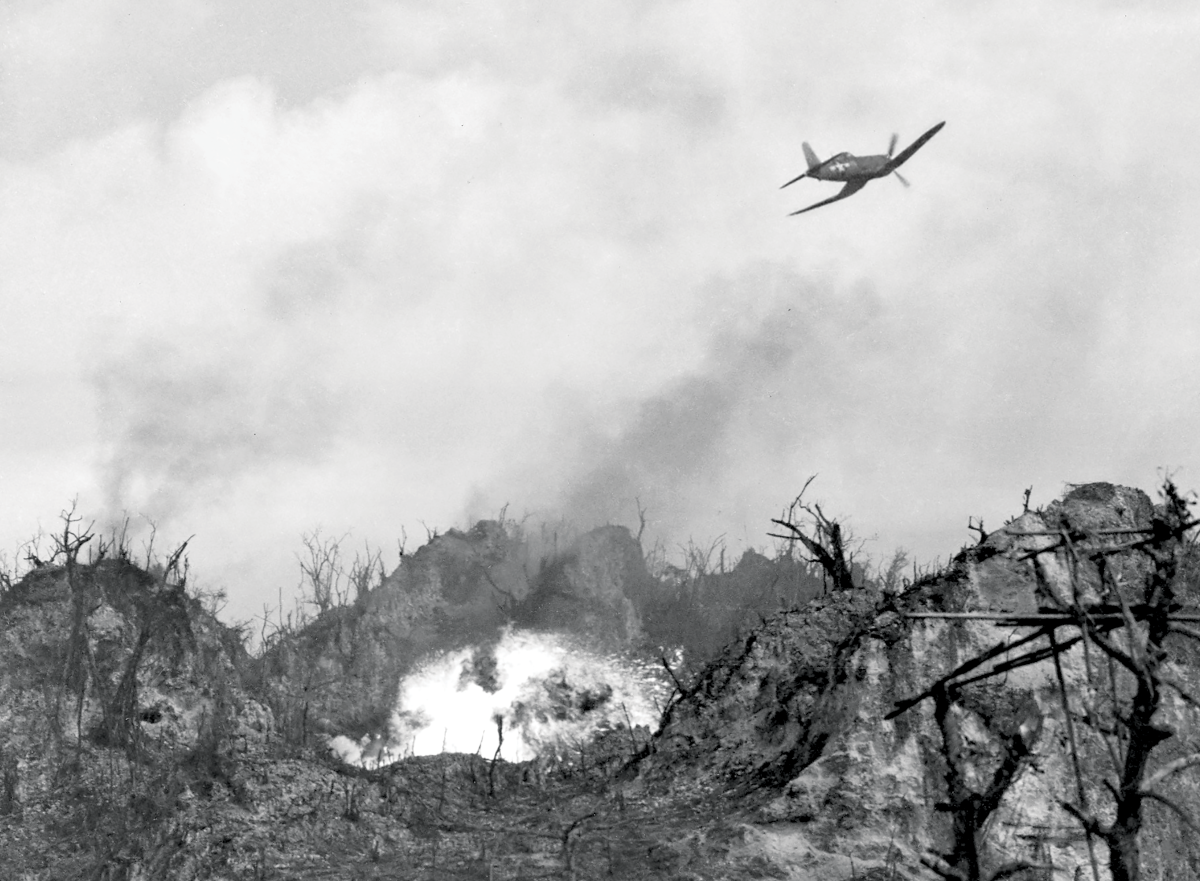 An F4U Corsair drops napalm during battle for Peleliu's Umurbrogol Mountain
