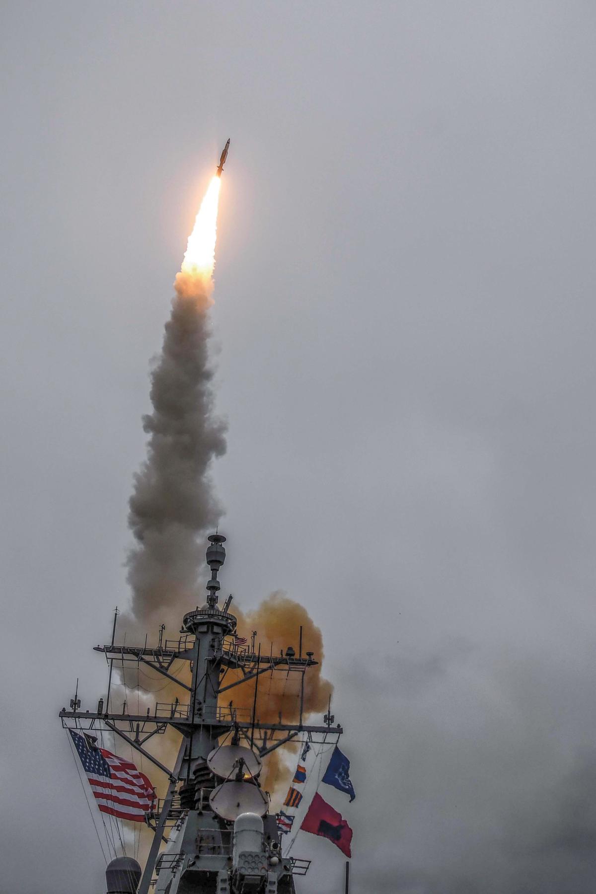Arleigh Burke-class guided-missile destroyer USS Donald Cook (DDG-75) fires a Standard Missile 3