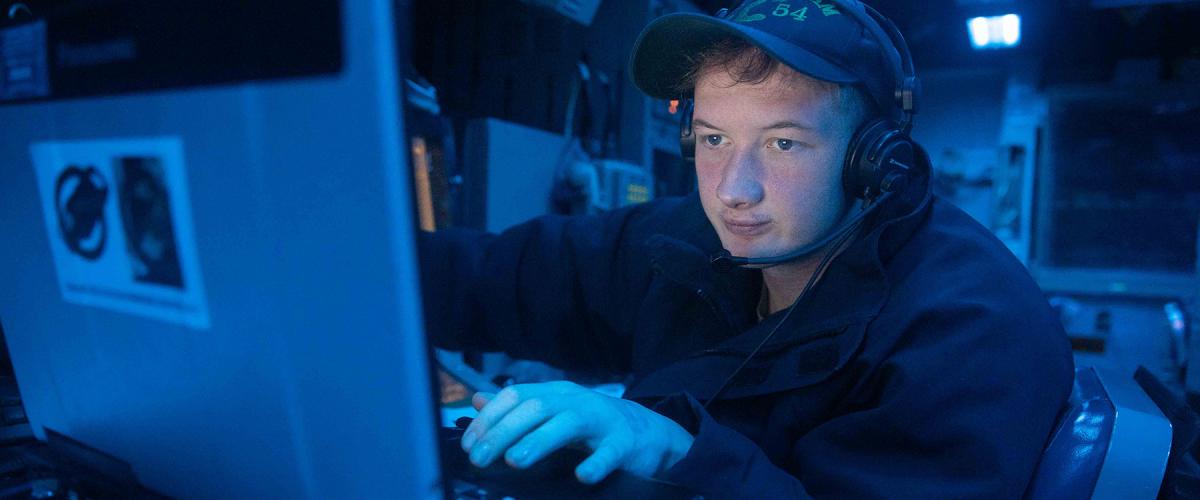 A CTT monitors radio frequencies on board the USS Antietam (CG-54) in July 2023. The role of today’s Navy linguist seems to have simplified to mere translational work, with none of the formal analytical training given to the valiant linguists in the past.  