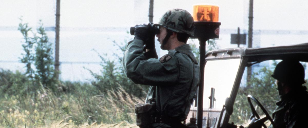  Members of the U.S. Army’s Berlin Brigade observe the Berlin Wall from the West German side. The U.S. Army occupied West Berlin from July 1945 to September 1994, steadfast through the Berlin Airlift, the Checkpoint Charlie Crisis, and Able Archer 83 debacle. 