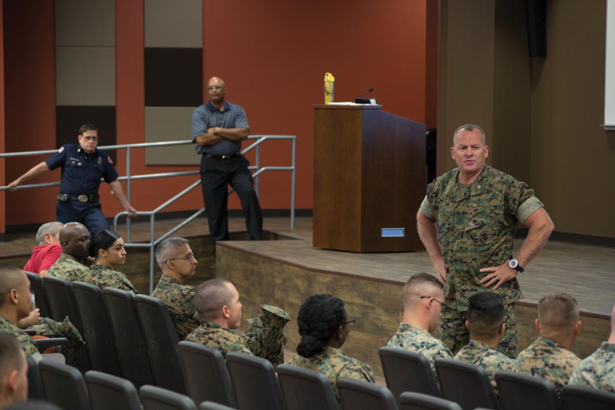 Col. Martin, USMC, conducting a safety standdown in an auditorium in 2017