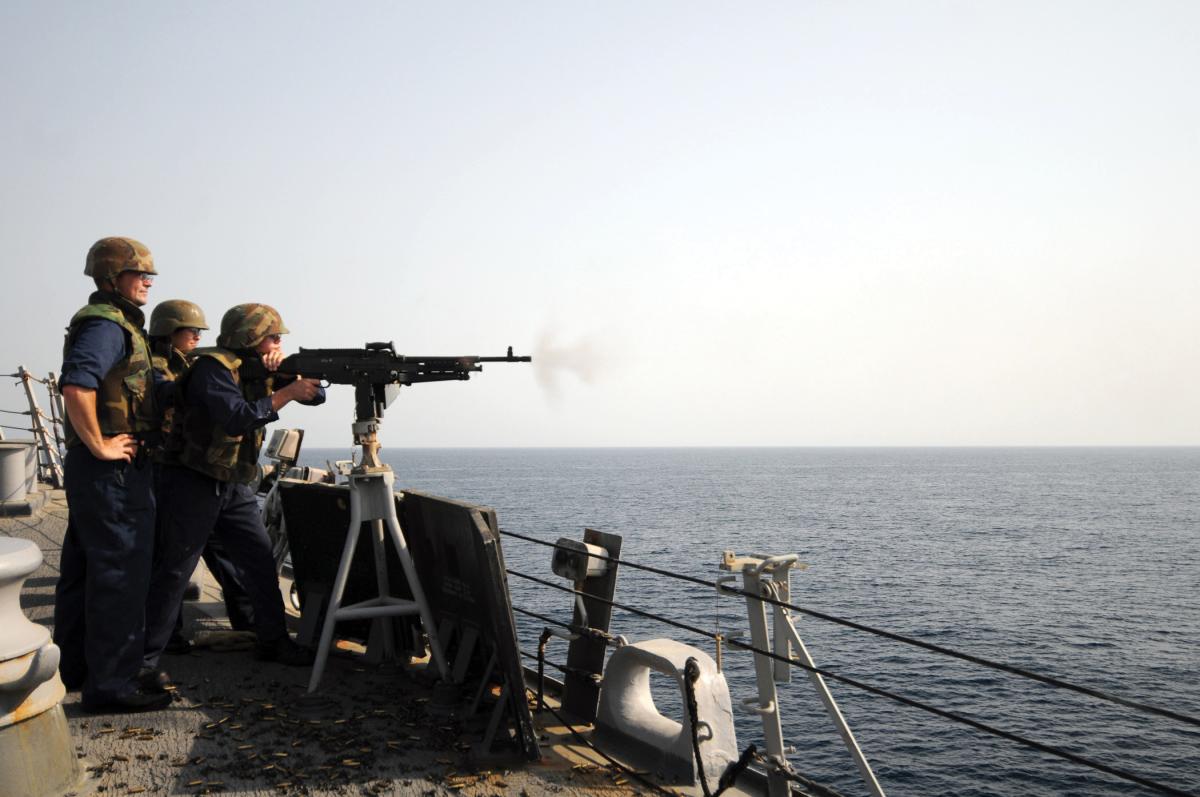 A chief petty officer and ensign observe a weapons exercise on board the Mitscher (DDG-57)