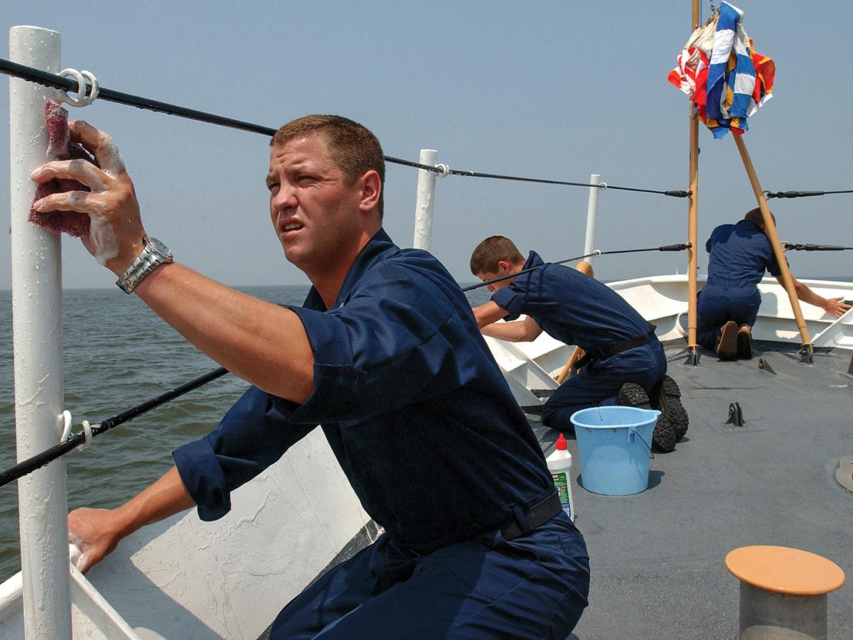 Cuttermen scrub down the cutter Bainbridge Island (WPB-1343)