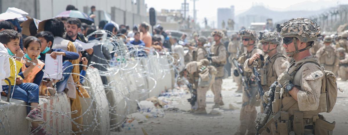 Marines provide assistance during the evacuation at Hamid Karzai International Airport, Afghanistan.