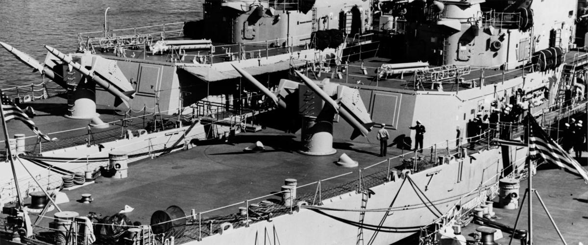 The USS King (DLG-10) tied up in San Diego between the Coontz (DLG-9) and Mahan (DLG-11) with Terrier missiles on their launching racks.
