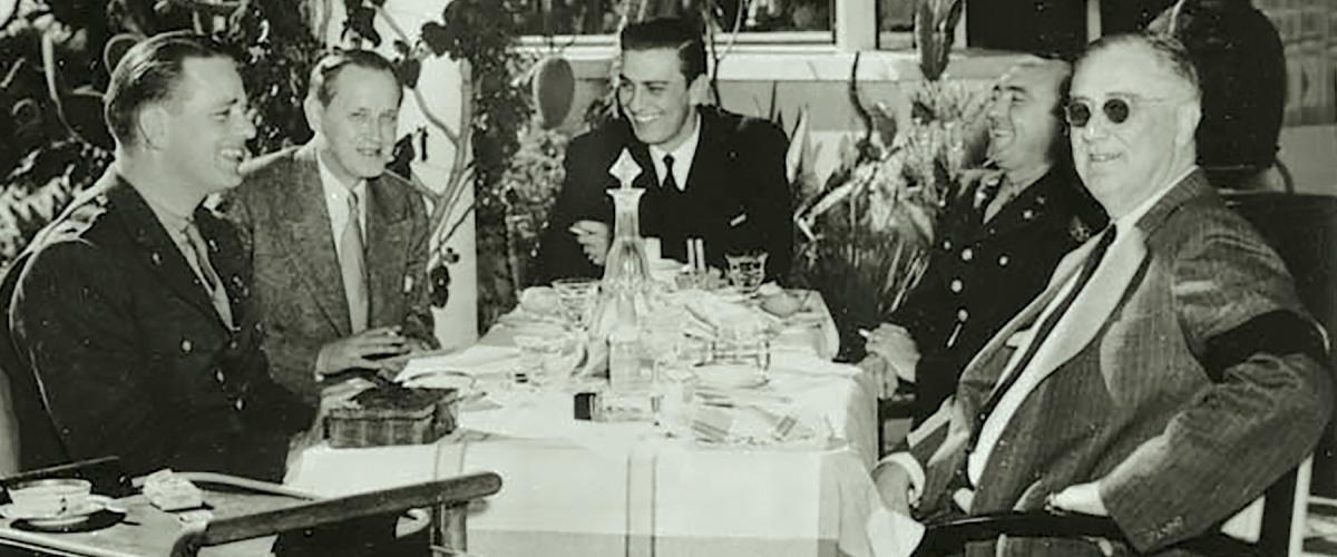 President Franklin D. Roosevelt at lunch with his son Elliott Roosevelt, Harry Hopkins, Franklin D. Roosevelt Jr., and George Durno during the 1943 Casablanca Conference.