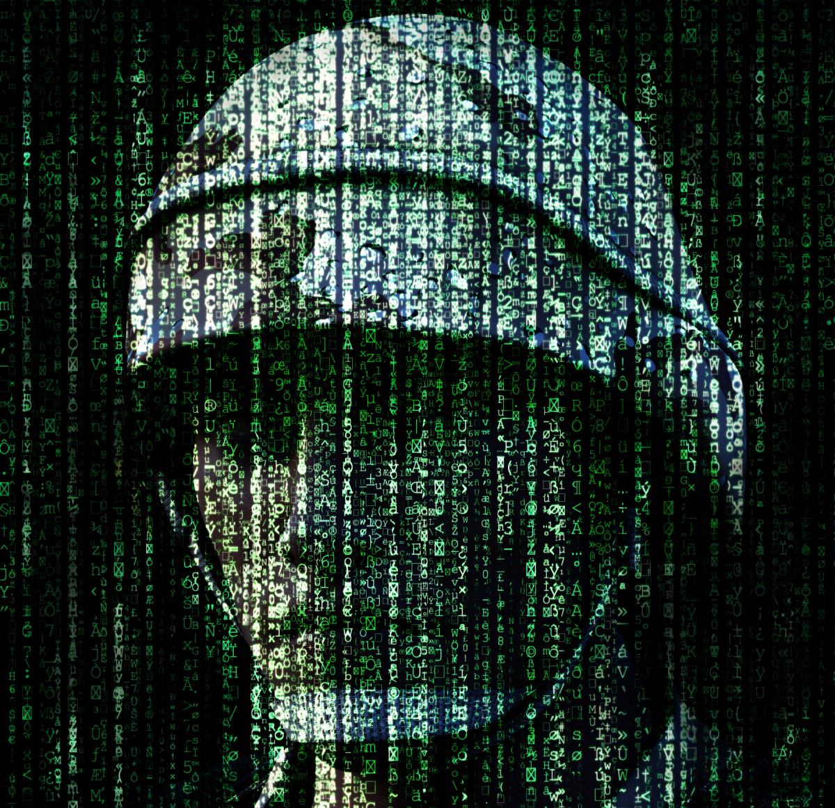 Marine silhoutted by computer code
