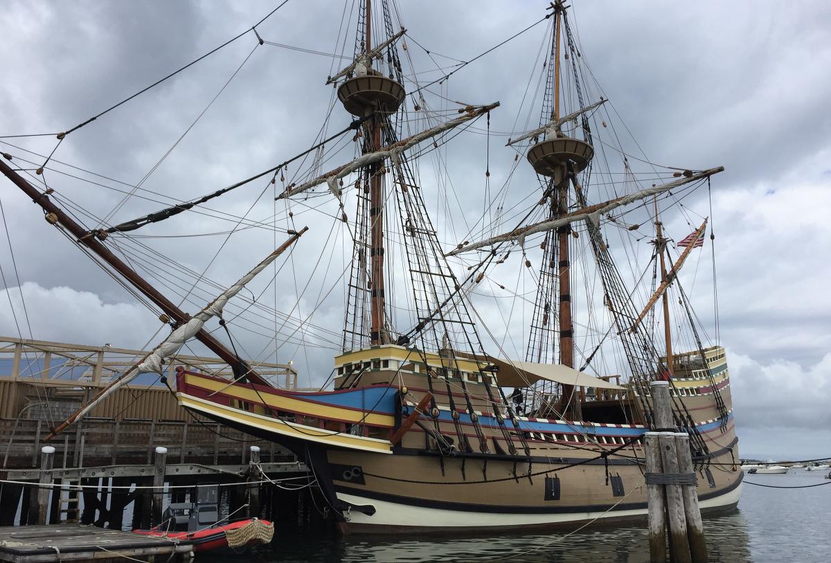 Visitors can see the Mayflower II and her painted sloping sides from the State Pier on Water Street.