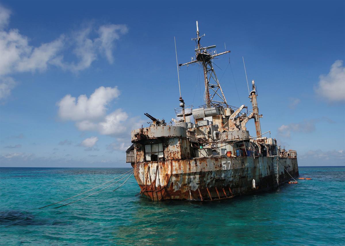 A troop of Philippine Marines permanently lives on board the Sierra Madre, a World War II–era tank landing ship intentionally grounded on the Second Thomas Shoal, inset, in 1999 to bolster the island nation’s claim to the South China Sea territory.
