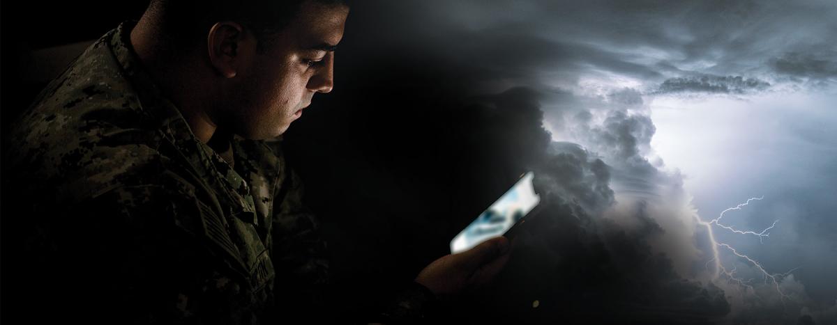 sailor views his cellphone