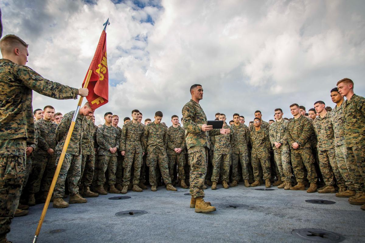 U.S. Marine Corps Capt. Joseph Murphy, center, commanding officer of Fox Company, Battalion Landing Team, 2nd Battalion, 6th Marine Regiment, 26th Marine Expeditionary Unit (MEU) and commander of troops aboard the dock landing ship USS Oak Hill (LSD 51), addresses Marines after a promotion ceremony aboard the Oak Hill in the Atlantic Ocean, Dec. 1, 2017