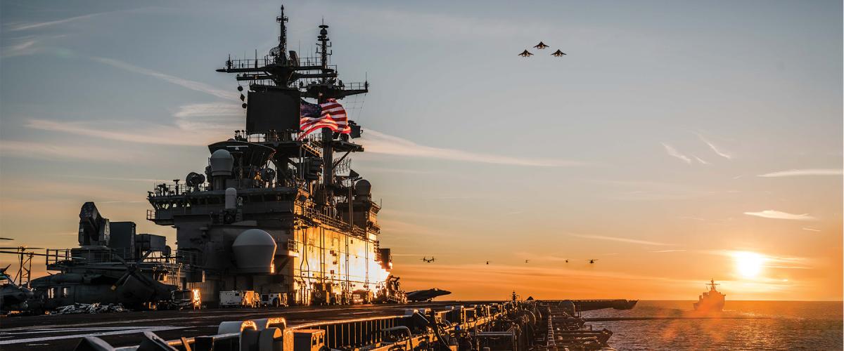 Marine Corps aircraft fly over the USS Kearsarge (LHD-3) in the Baltic Sea