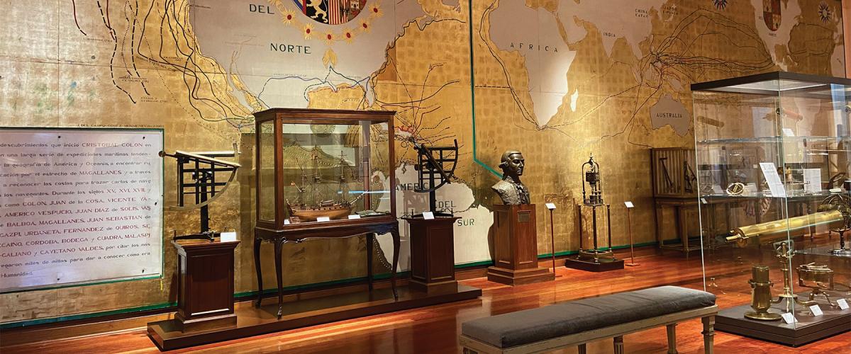 A gallery in the Museo Naval with a mural depicting Spanish voyages of discovery.