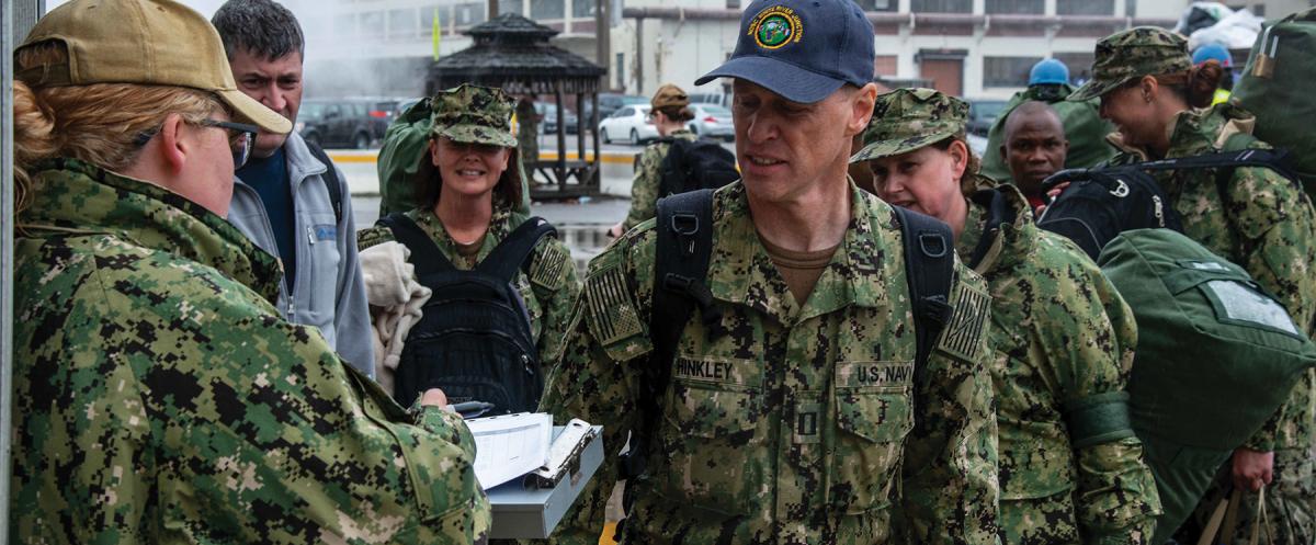 Today, Navy Reserve forces are tightly aligned to critical warfighting functions, to maximize their mandate to provide wartime strategic depth. Here, sailors check in at the hospital ship USNS Comfort (T-AH-20) to support her deployment.