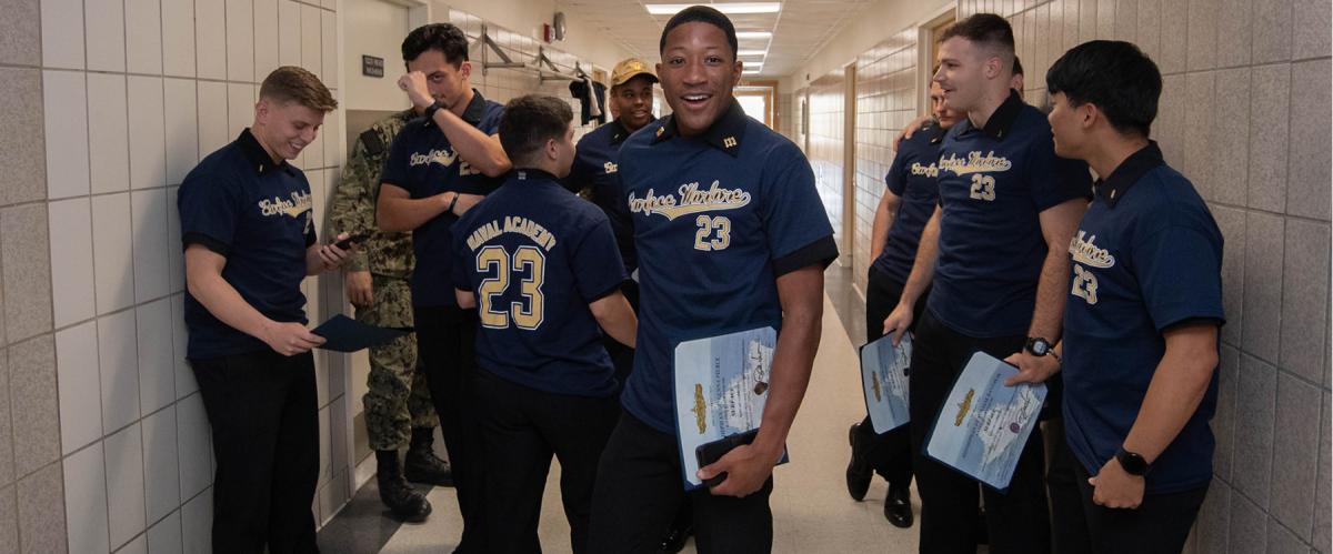 U.S. Naval Academy Class of 2023 midshipmen celebrate their selection as surface warfare officers on service selection night, 17 November 2022. 