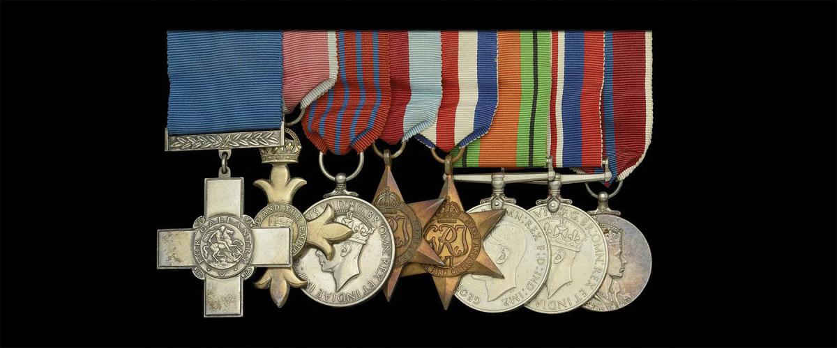 The impressive array of (richly deserved) medals of the “Man Who Saved Charing Cross.” The George Cross, OBE, and George Medal are on the left (l. to r., respectively).