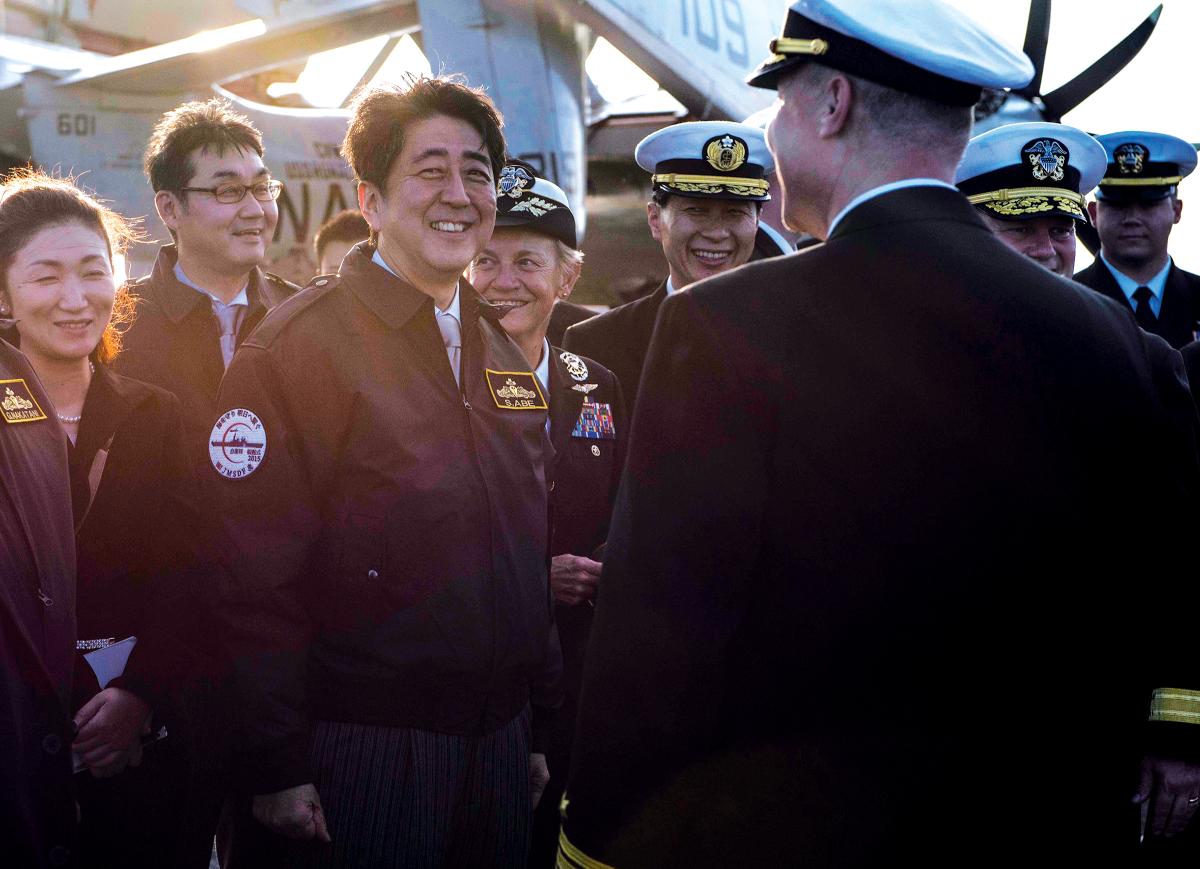As prime minister of Japan, Shinzo Abe—here, on the carrier USS Ronald Reagan (CVN-76)—was an important U.S. ally, but his connection to the American people began four decades prior, as a student at the University of Southern California.