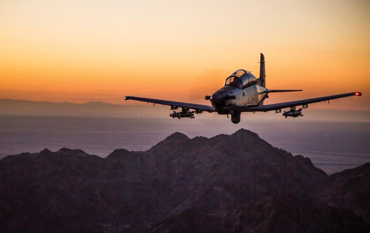 The Navy needs a smaller, more versatile fixed-wing counterinsurgency aircraft to operate from its carriers and land bases. A modified AT-6 Wolverine could be the answer.