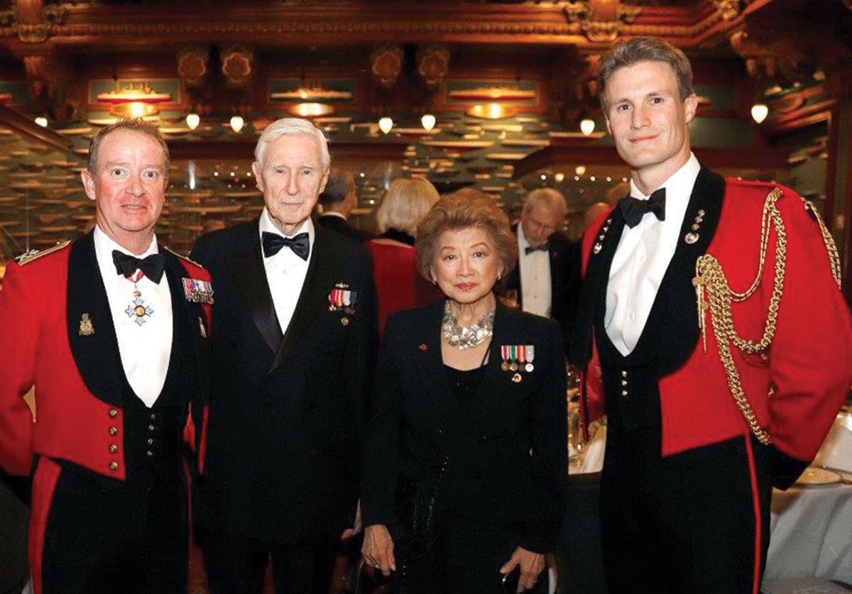 Captain Sally McElwreath and her husband, Rear Admiral Joe Callo—flanked by Major General Matt Holmes, Commandant General Royal Marines, left, and his aide, Captain Henry Townend—at the New York City Pickle Night Dinner in 2019. Started by the Callos 16 years ago, this annual dinner commemorates Admiral Lord Nelson’s victory at the Battle of Trafalgar and HMS Pickle, the smallest vessel in the 1805 battle.