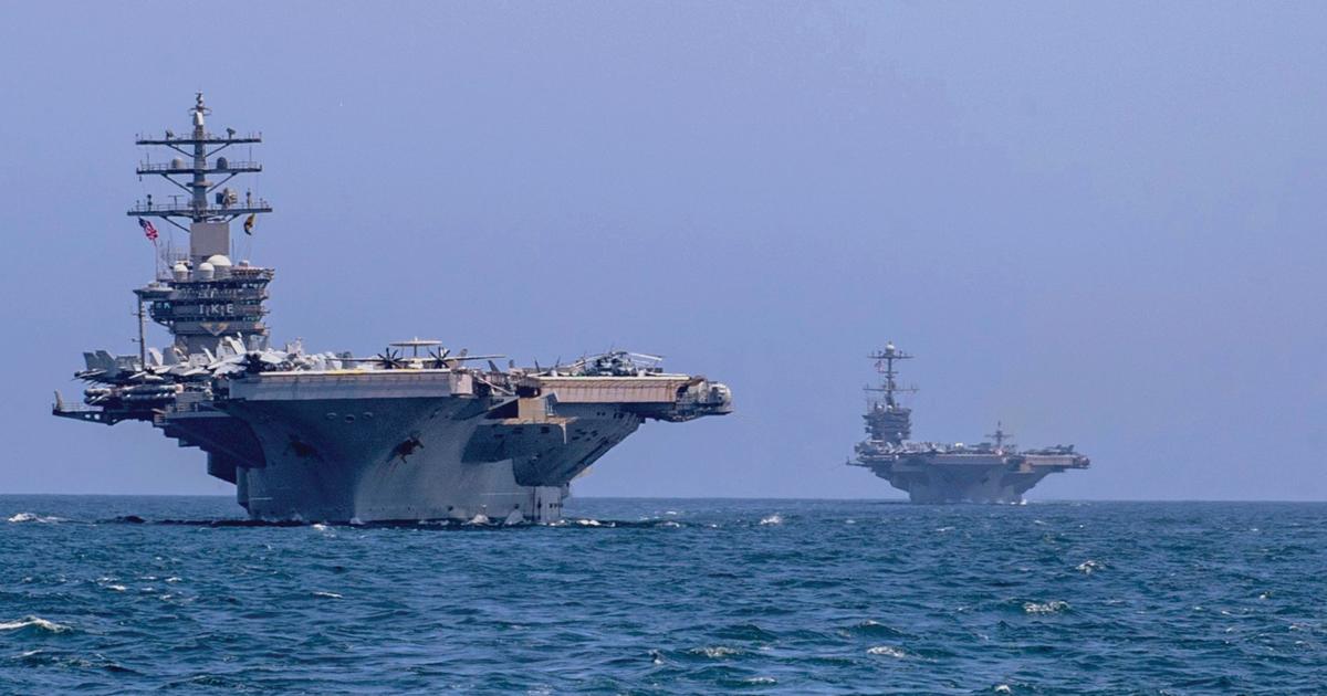 The USS Dwight D. Eisenhower (CVN-69), left, and the USS Harry S. Truman (CVN-75) in the Arabian Sea in March.